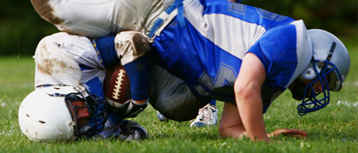 football player getting tackled 